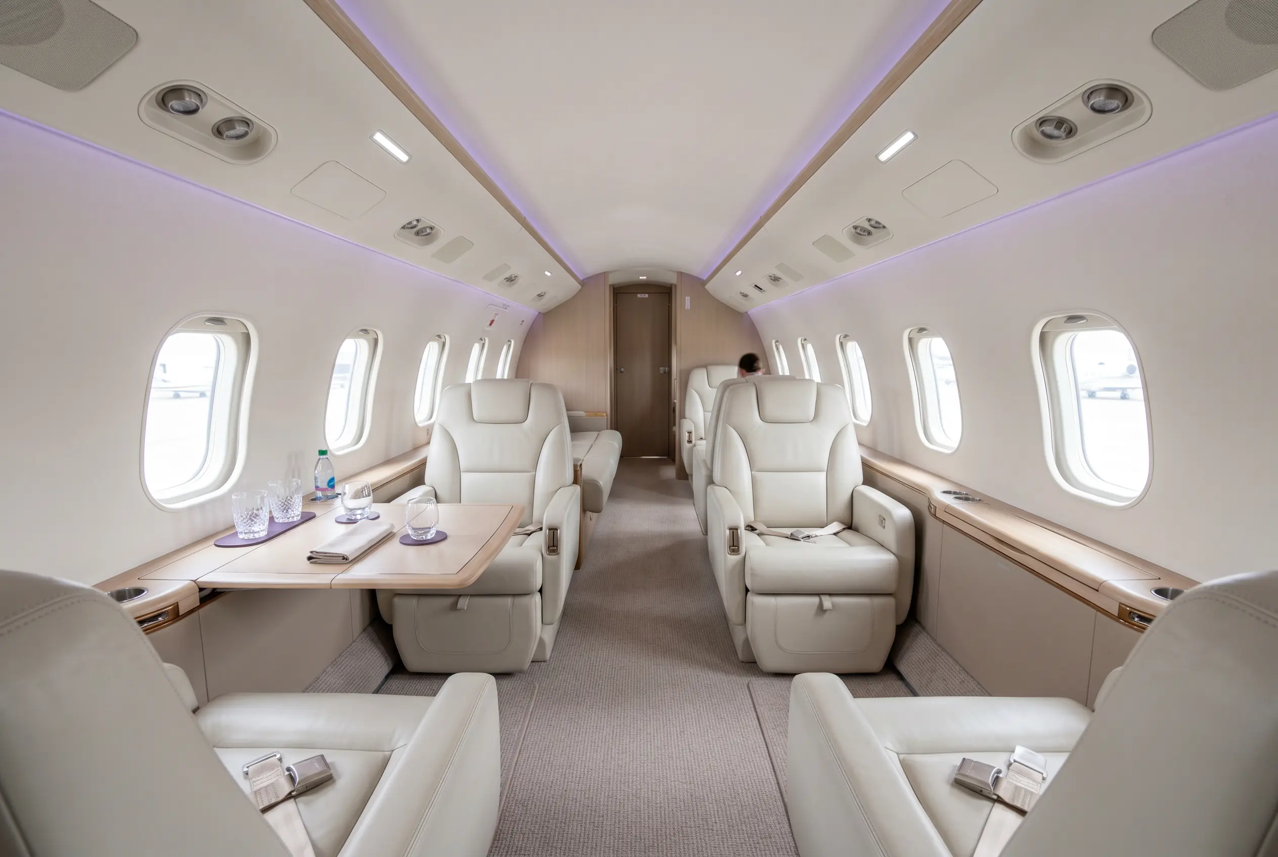 Empty private jet cabin with club seating ready for a discounted Miami to New York empty leg