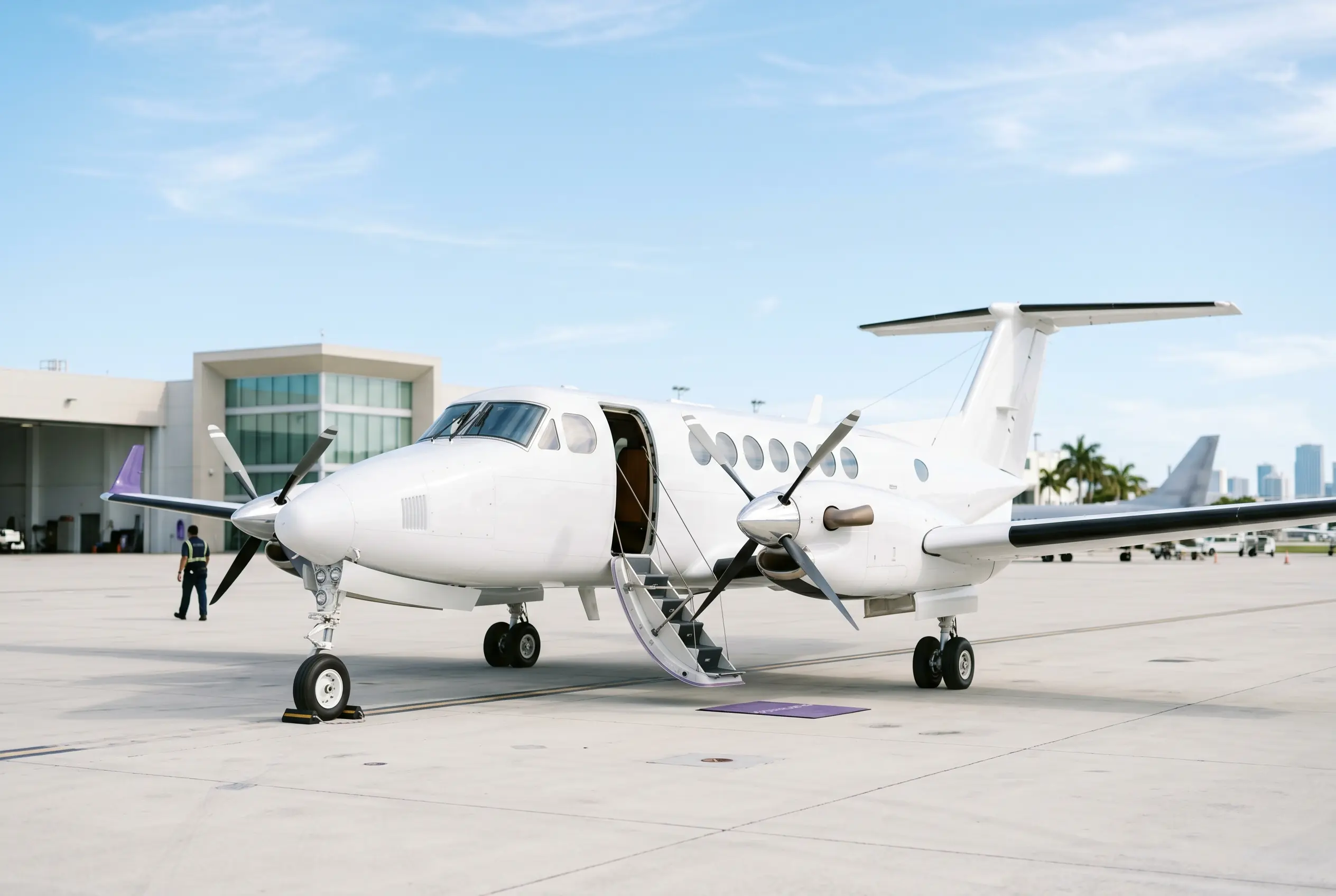 King Air 350 with airstair down on a Miami ramp ahead of a departure to New York