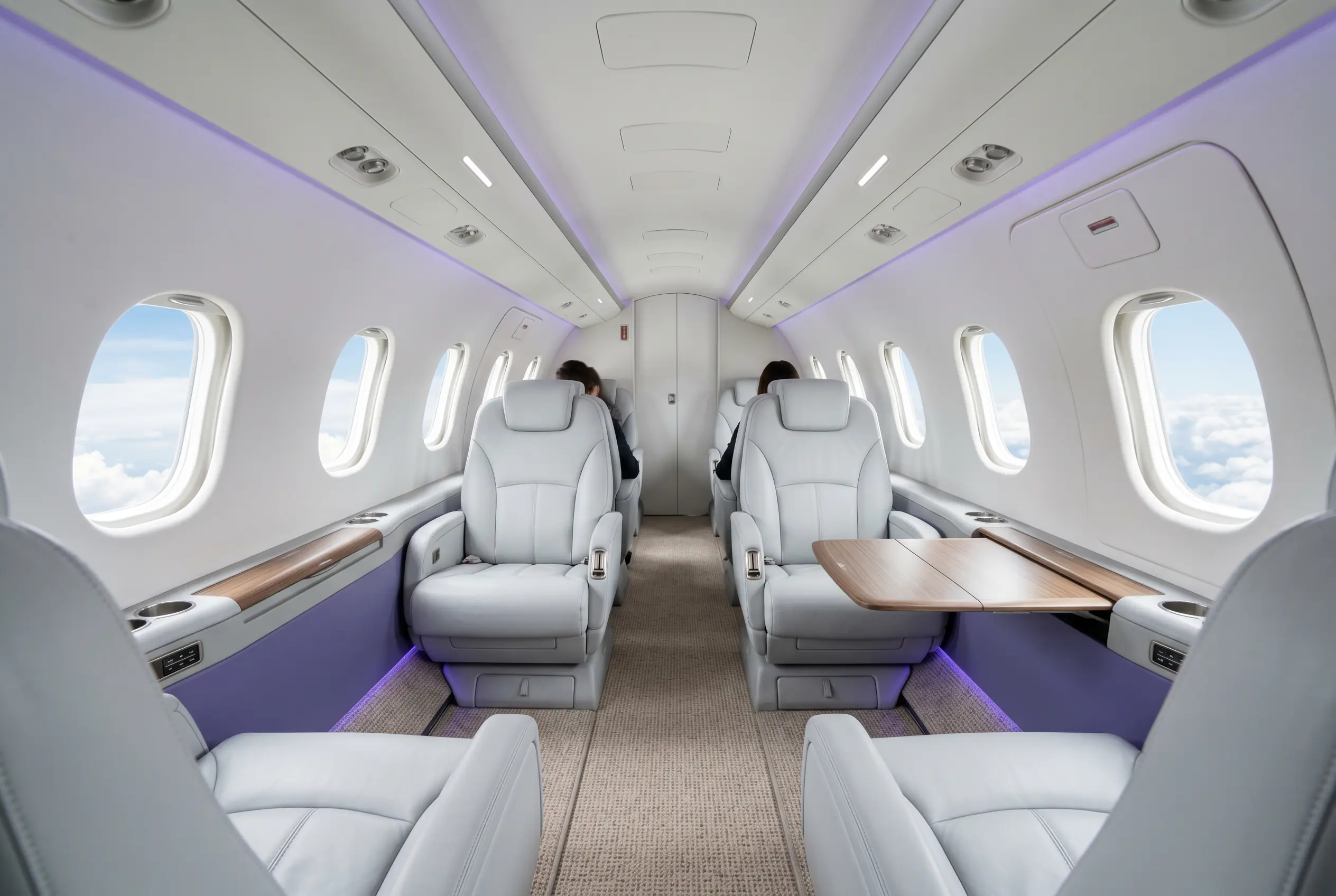 Learjet 75 cabin with club seating — Miami to New York charter interior
