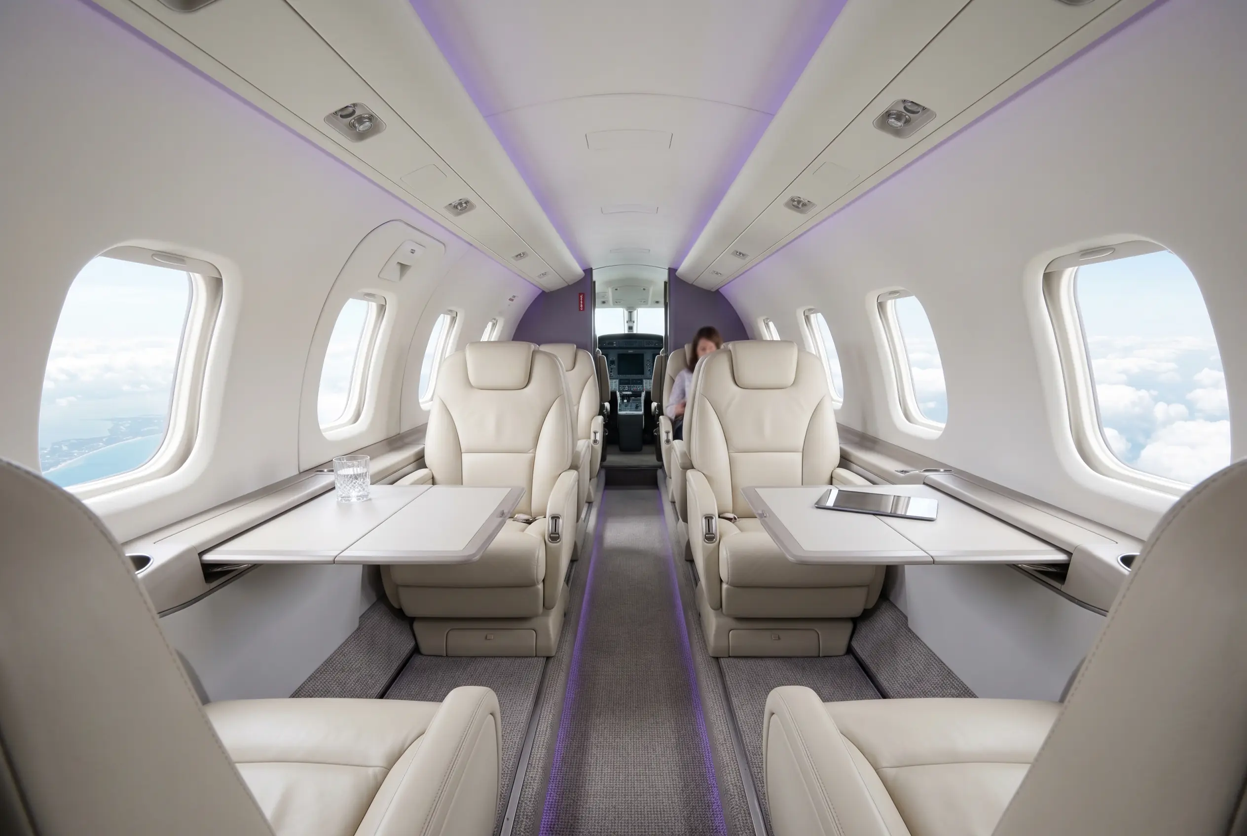 Pilatus PC-12 executive cabin with club seating set for a Miami to New York charter